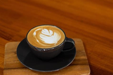 Premium Photo Hot Latte Art Coffee On Wood Table Relax Time