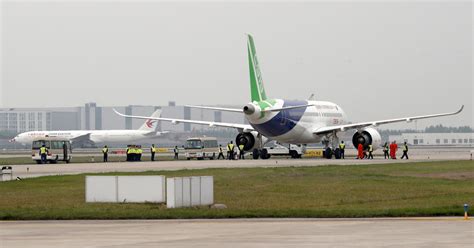 China S First Large Passenger Jet Makes Its Maiden Flight Cbs News