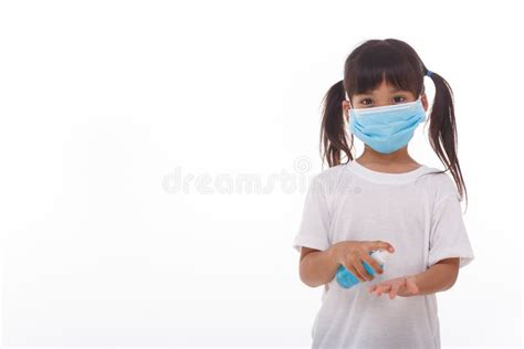 Little Girl Using Alcohol Gel For Cleaning Hands Stock Photo Image