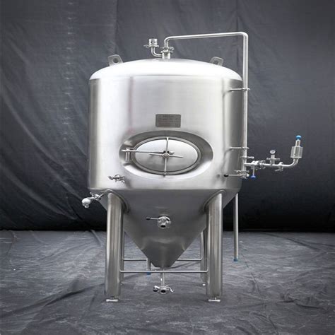 A Large Stainless Steel Tank Sitting In Front Of A Black Backdrop With