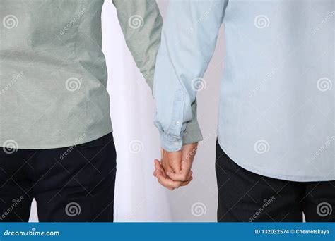 Gay Couple Holding Hands On Light Background Stock Photo Image Of Boyfriend Freedom 132032574