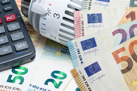 Heating Thermostat And Calculator On Euro Money Banknotes Concept Of