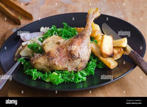 Roast duck legs Stock Photo - Alamy