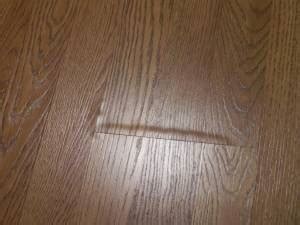 Swelling Bubbling In Laminates And Hardwood Floors Causes Solutions