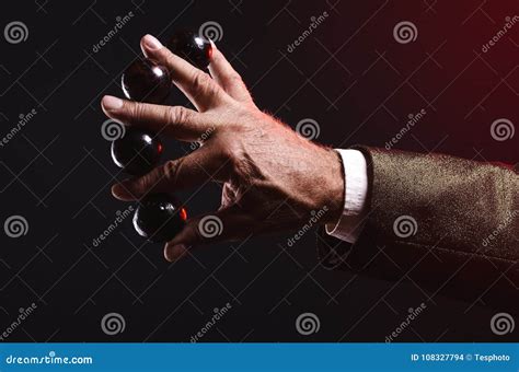 Magician Shows Trick With Magic Balls. Manipulation With Props. Stock ...