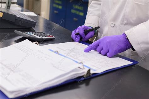 Lab Technician Recording Data Stock Image F0210200 Science Photo