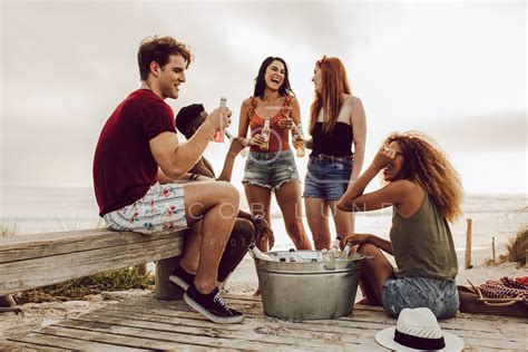 Friends hanging out by the beach – Jacob Lund Photography Store ...