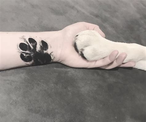 People are "Branding" Themselves with Dog Paw Tattoos