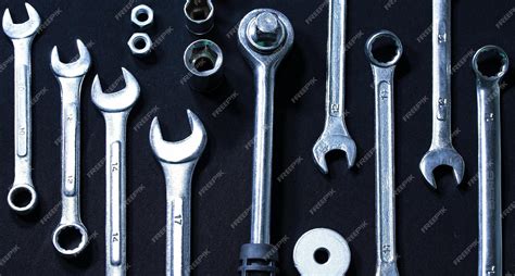 Premium Photo | Set of wrenches and spanners on black surface isolated