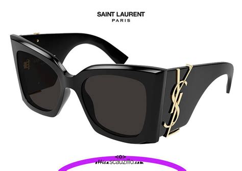 Oversized black Saint Laurent M 119 sunglasses with gold YSL logo | Occhiali | Ottica Scauzillo