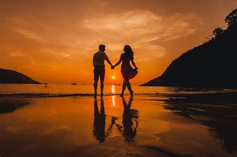 Premium Photo | Couple holding hands on the beach