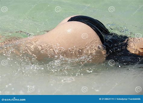 Girl Summer Vacation Woman In Water Buttocks In Bikini Summertime Holidays On Ocean Sea