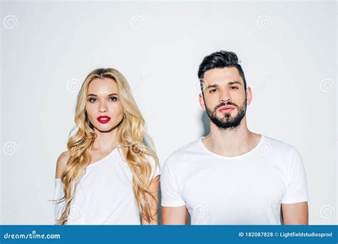 Bearded Man And Beautiful Blonde Girl Looking At Camera On White Stock Photo Image Of