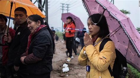 China: Rescue called off at flattened village as authorities warn of ...