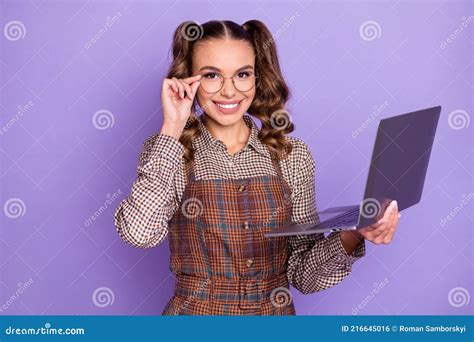 Photo Of Adorable Cheerful Girl Hold Netbook Hand Correct Glasses