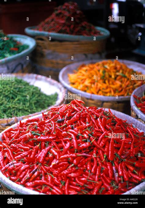 An Abundance Of Colourful Fresh Chillies On Display In Baskets At A