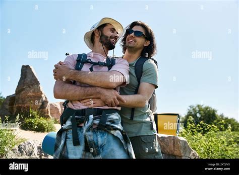 A Gay Couple Enjoying A Summer Hike Together In Nature They Are Walking Through The Wilderness