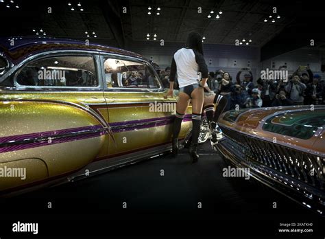 A Model Poses For The Cameras Next To The Custom Hot Rod Car Is Shown During The Th Annual