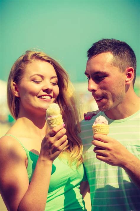 Man And Woman Eating Ice Cream On Beach Stock Photo Image Of Cream