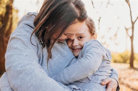 Premium Photo Closeup Portrait Of A Mother Holding Her Daughter In