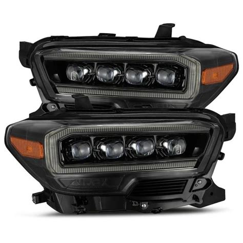 pair of black headlights with chrome trims for the front end of a car ...