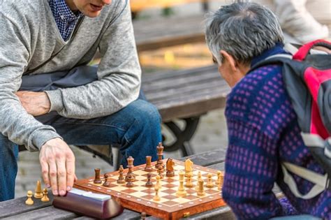 Premium Photo Old People Playing Chess In The Park