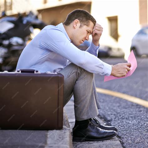 Premium Photo | Businessman worry or job loss in street with letter