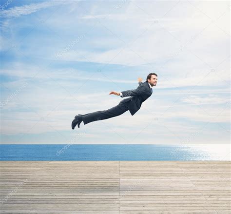 Man In Suit Flying Over Boardwalk Stock Photo By ©kantver 39564857