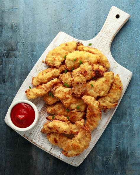 Buttermilk Chicken Nuggets with Ketchup on Wooden Board Stock Image ...