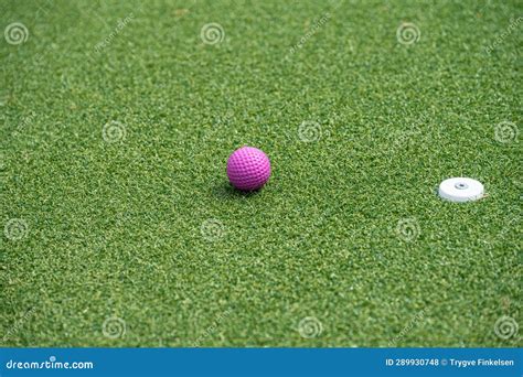 Miniature Golf Putter By Blue Ball And Hole Stock Photo Image Of