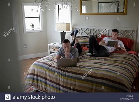 Gay Couple Relaxing Bed Hi Res Stock Photography And Images Alamy