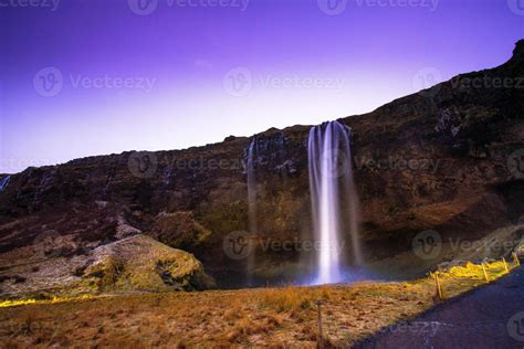 Seljalandsfoss, a waterfall with a small cave behind it in the south ...