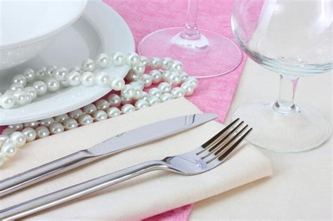 Premium Photo Table Setting With Fork Knife Plates Beads And Napkin