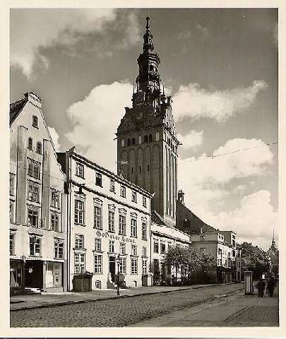 An Old Black And White Photo Of Some Buildings