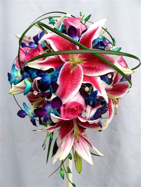 Beautiful Bouquet With Pink Lilies And Bright Blue Purple Accent