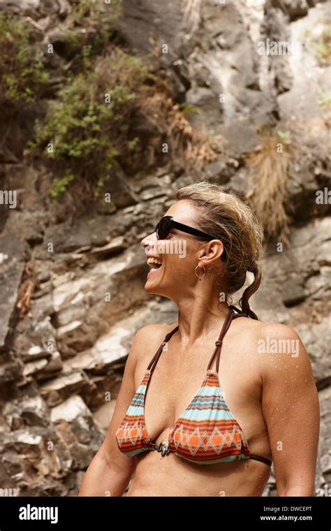 Mature Woman In Bikini And Sunglasses Laughing Stock Photo Alamy