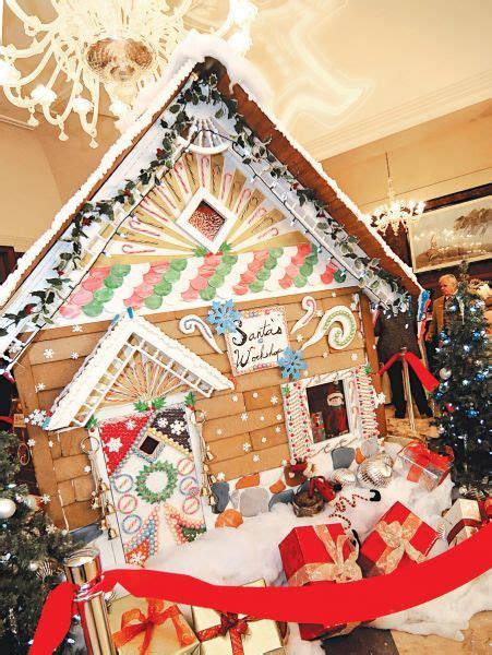 a gingerbread house is decorated for christmas