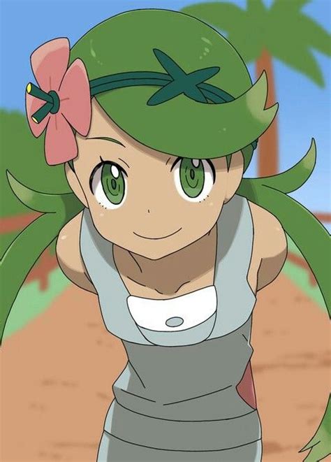 An Anime Character With Green Eyes And A Flower In Her Hair