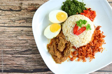 Indonesian Cuisine Nasi Padang Rice With Beef Rendang Salty Anchovy