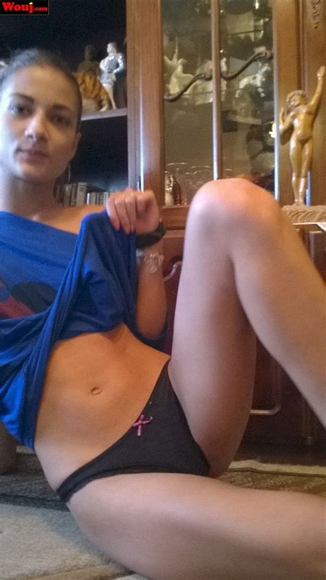 Hot Brunette Babe Lifts Up Her Shirt And Shows Her Black Panties Photos