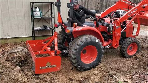 Kubota L2501 Removes Stump With Front Bucket And Box Blade Youtube