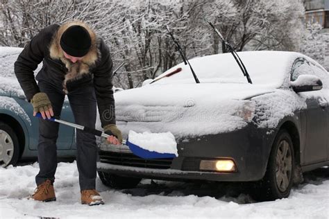 Man Cleans Snow From A Car On A Winter Morning Stock Image Image Of