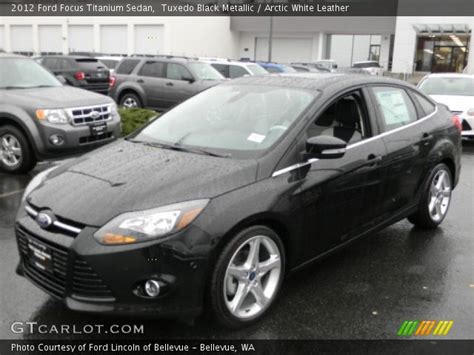 Tuxedo Black Metallic Ford Focus Titanium Sedan Arctic White