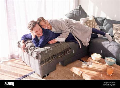 Happy Gay Couple Relaxing On Sofa Stock Photo Alamy