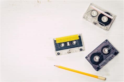 Premium Photo Directly Above Shot Of Audio Cassettes And Pencil On Table