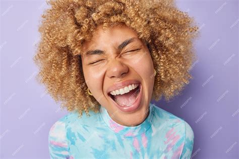 Premium Photo Close Up Shot Of Overjoyed Curly Haired Young Woman