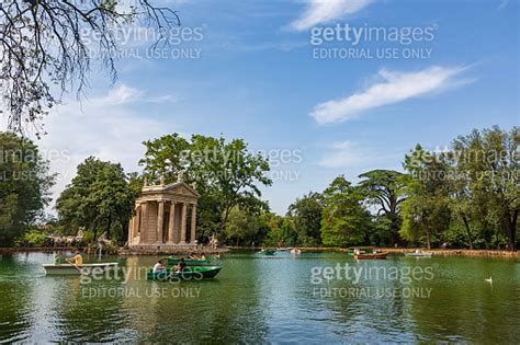 Rowing A Boat Near The Temple Of Asclepius In Rome Italy