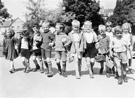 File A Group Of Smiling Evacuees From Rotherhithe In Kent With Gas Mask Boxes Hold Hands On A