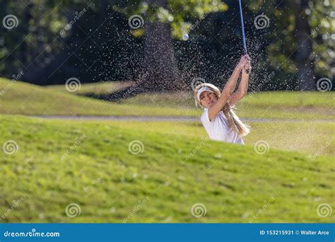 A Lovely Blonde Female Golfter Enjoying A Round Of Golf On A Public Golf Course Stock Image