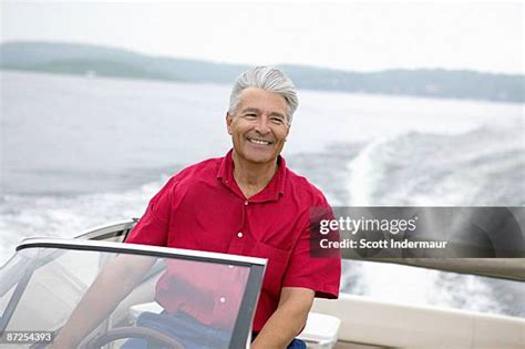 Man Driving Boat Lake Photos And Premium High Res Pictures Getty Images